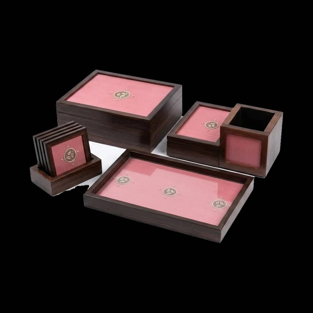 The Gulabi suite — rose silk and silver across the whole family.