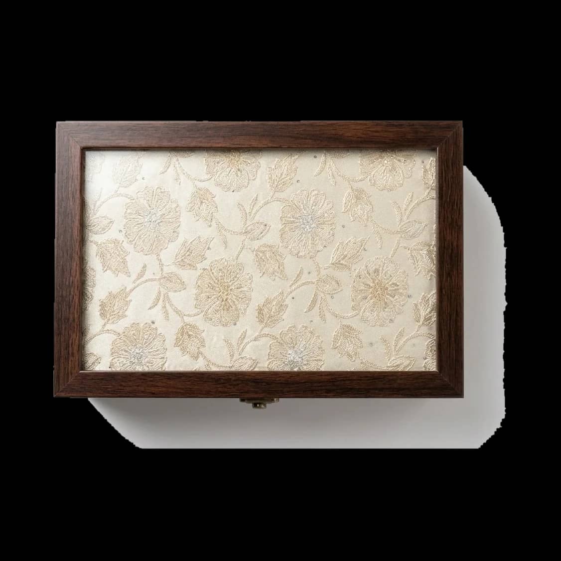 Champagne floral jacquard under glass, in warm walnut.