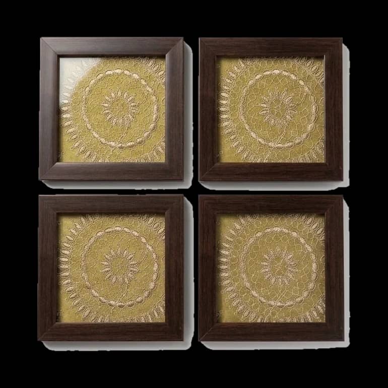 The Banaras mandala in olive-gold zari, framed dark.