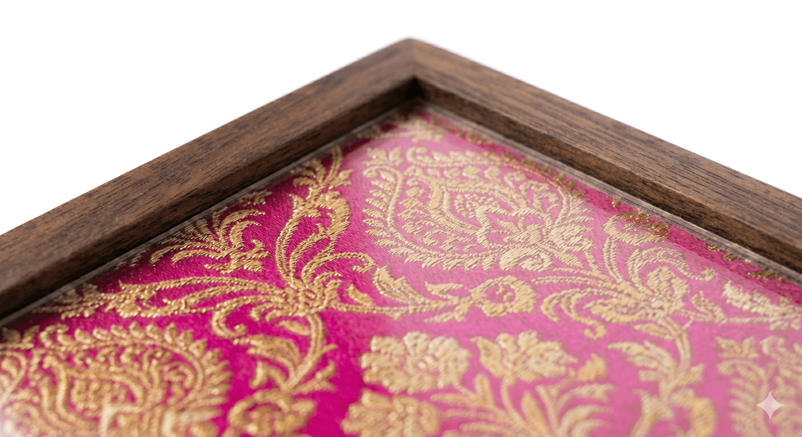 A close view of Banarasi silk and walnut — the textile under glass.