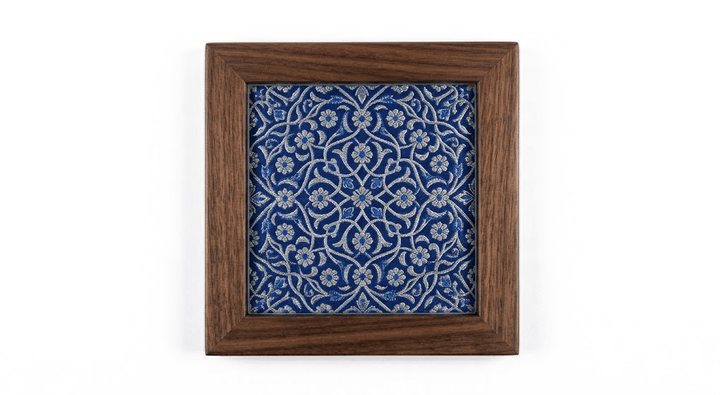 Five-inch coasters in solid wood and glass, each cut from a panel of hand-woven silk.